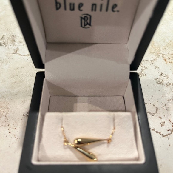 Elegant Gold Teardrop Earrings - Picture 7 of 9